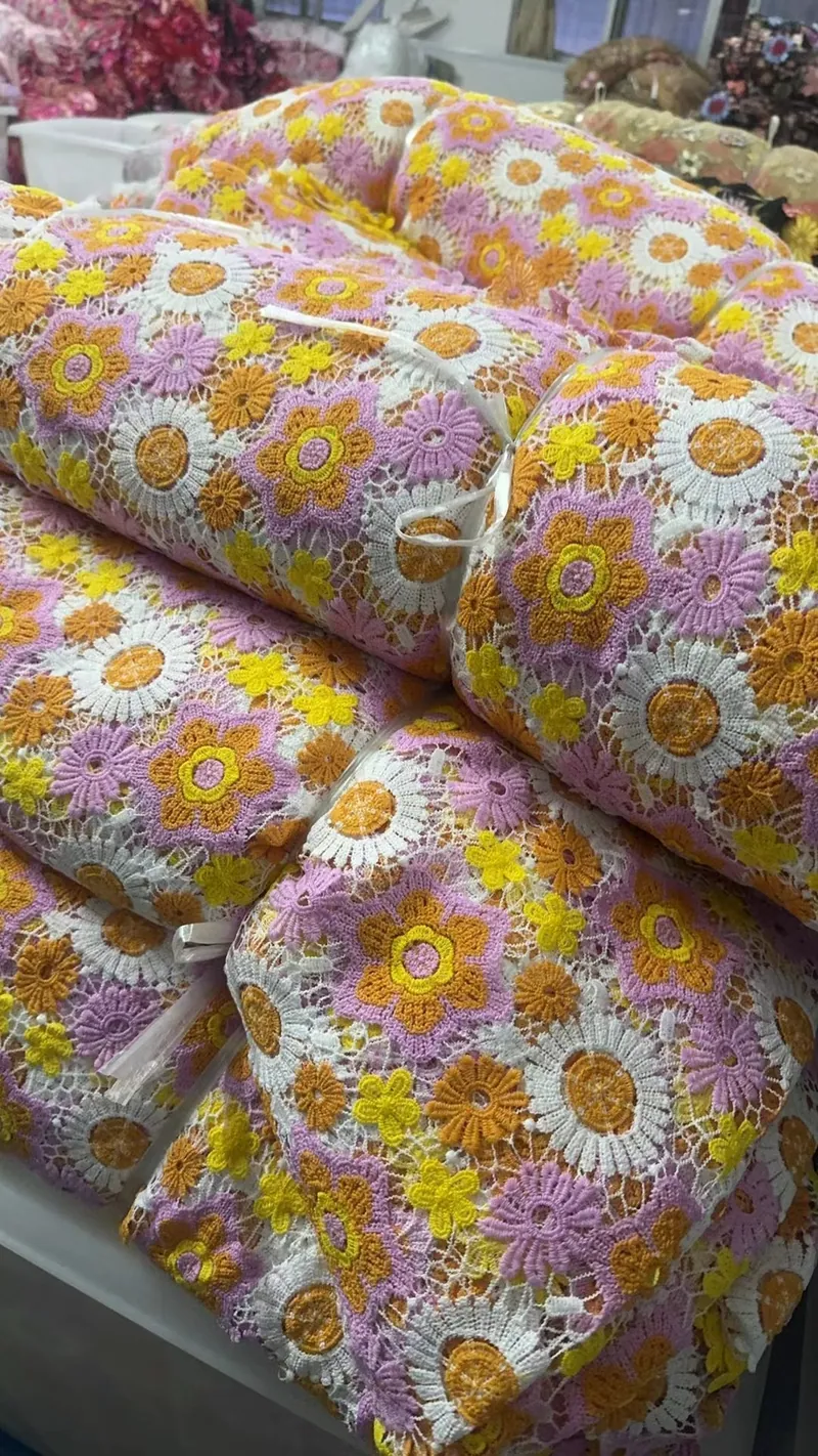 Embroidered fabric rolls in the warehouse