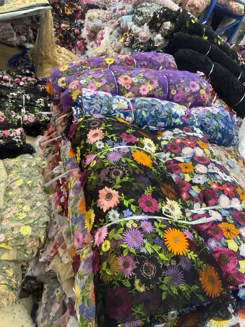 Embroidered fabric rolls in the warehouse