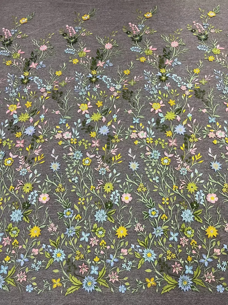 Fine meadow sprigs · embroidered fabric — H085 — Yellow, blue, pink & green